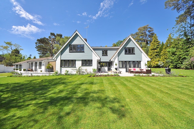 blue and white house with green lawn